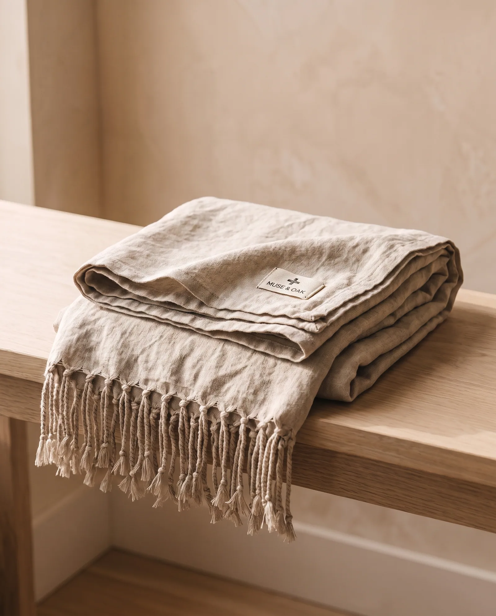 Linen Throw — Stonewashed, hand-knotted fringe.